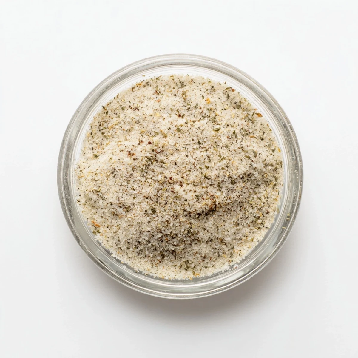 A freshly made blend of garlic salt, the coarse granules looking bright white against the bowl.