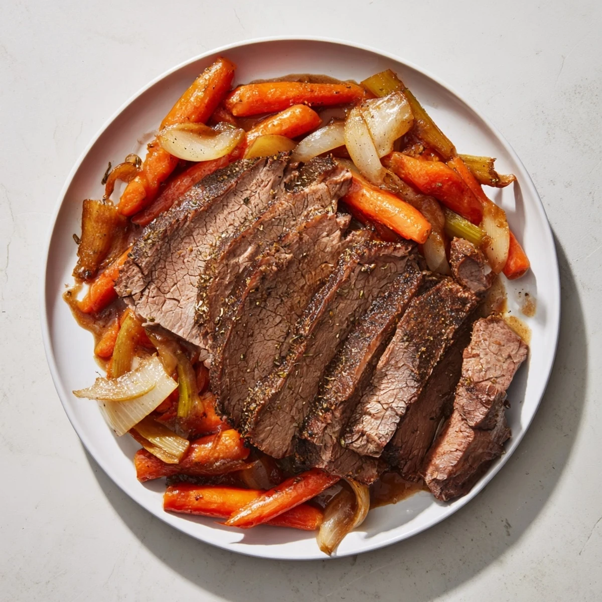 Tender, slow-cooked beef brisket, showcasing a rich, savory aroma, ready to serve with vegetables.