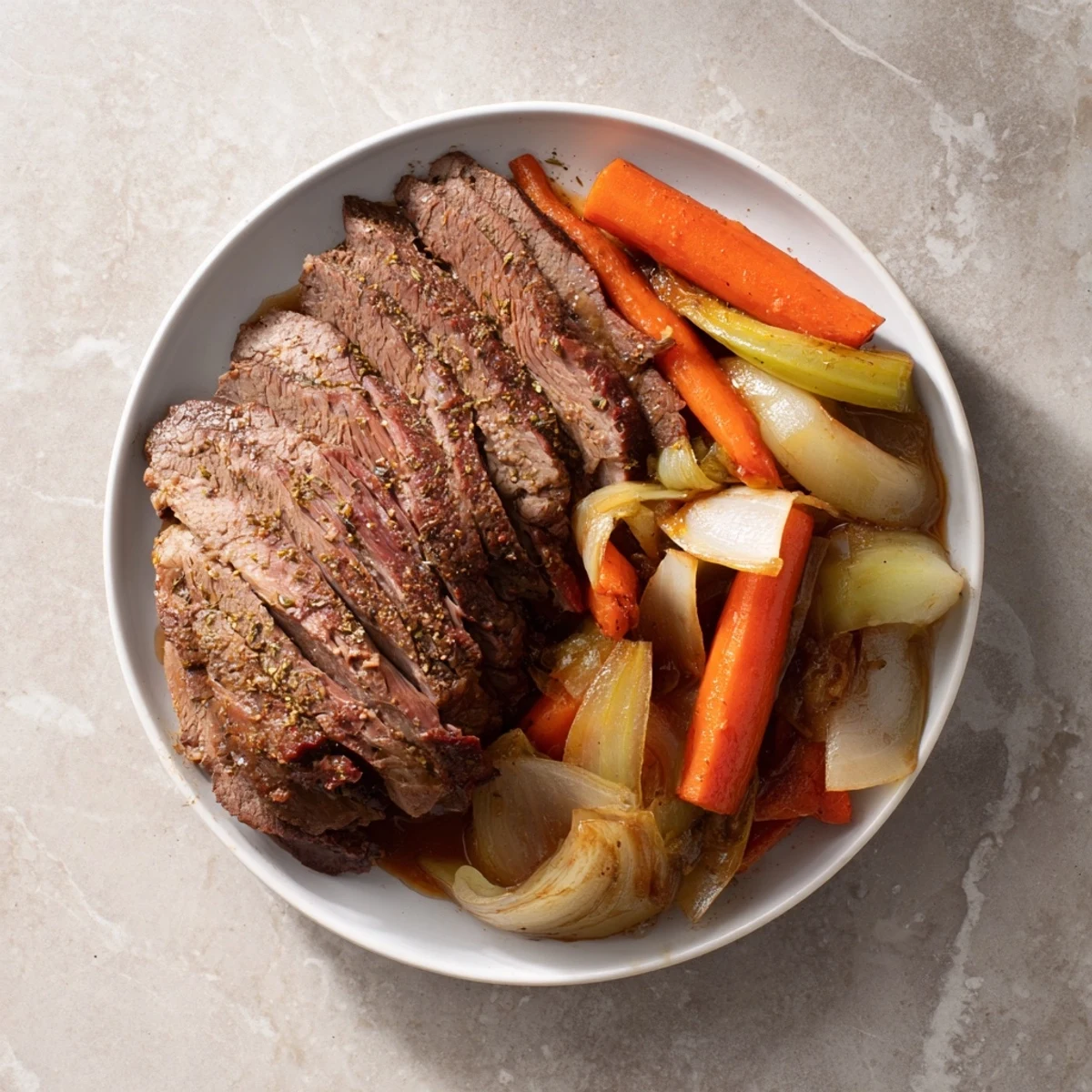 Fork-tender beef brisket, glistening with flavorful juices, perfect for a family feast.