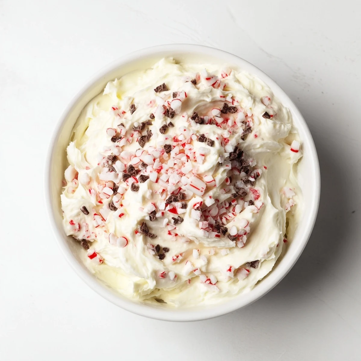 Enjoy this easy, no-bake Peppermint Fluff Dip; a delightful sweet treat for the holidays.