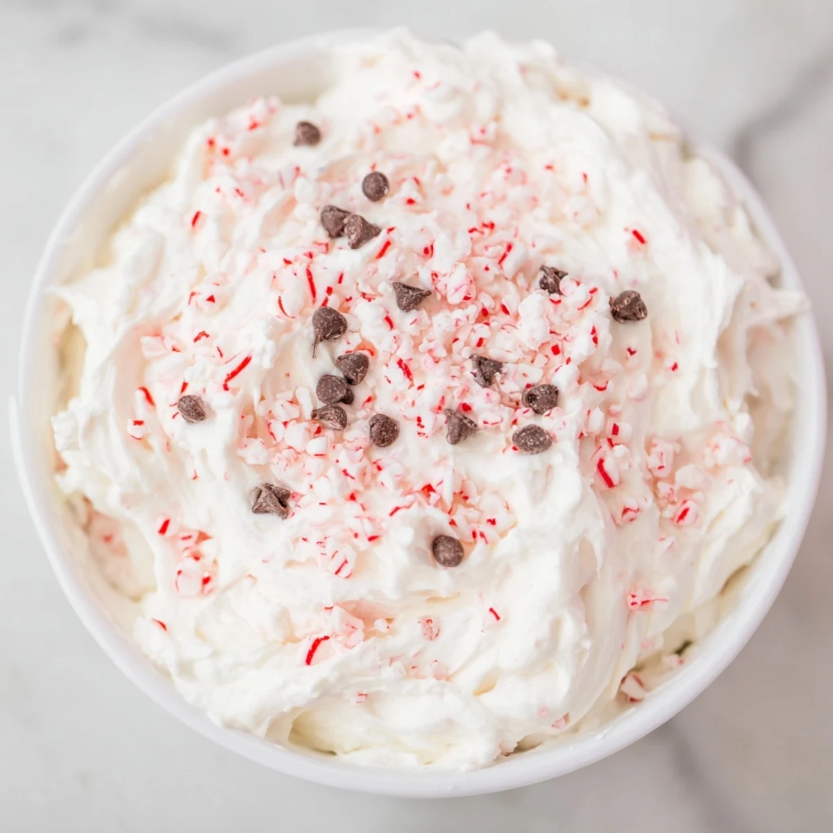This creamy Peppermint Fluff Dip is perfect for dipping cookies, crackers, even fruit.