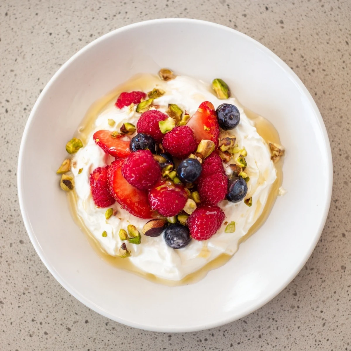 Smooth, chilled creamy yogurt, this simple dessert is made with fresh berries and a hint of vanilla.