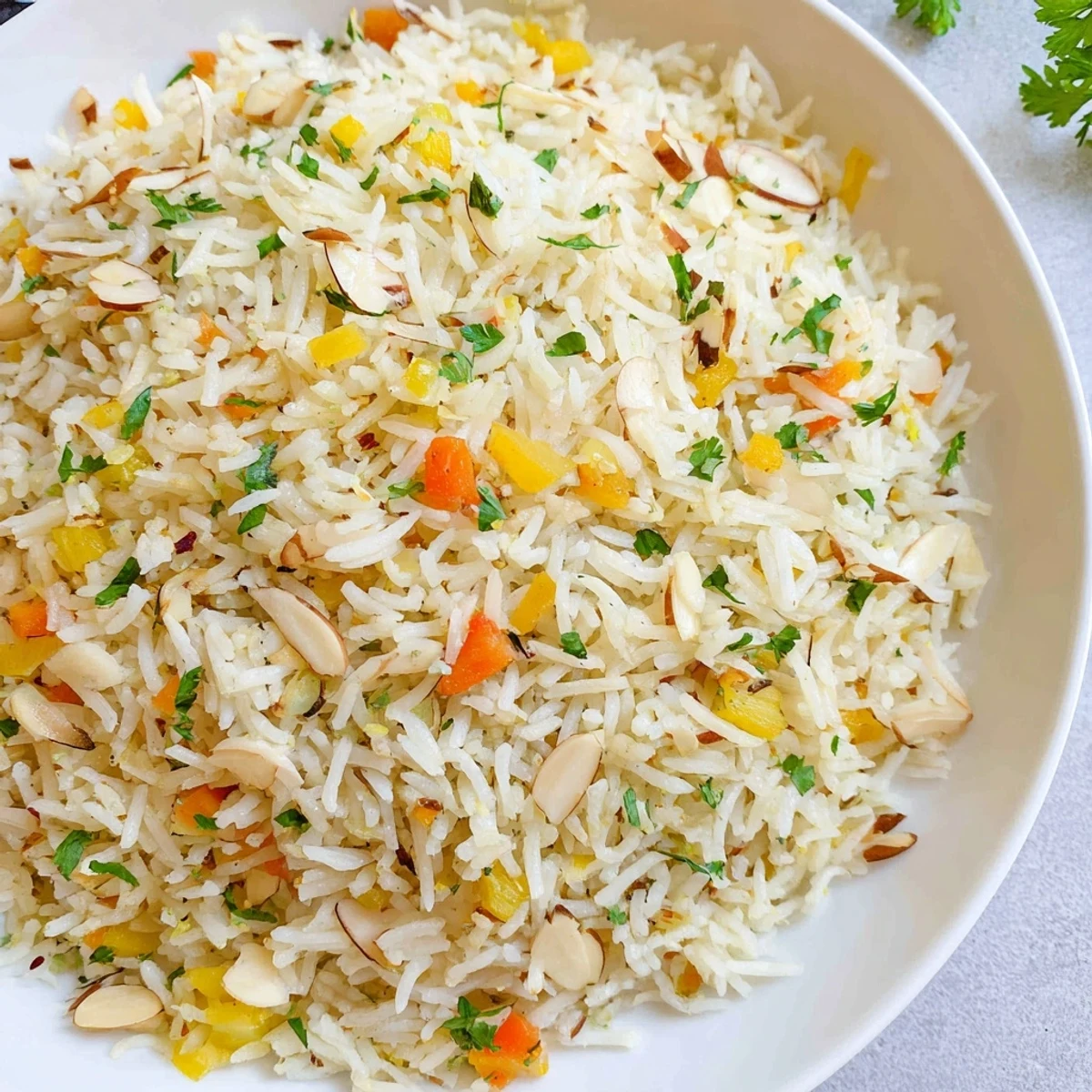 Aromatic Savory Rice Pilaf, fluffy and golden, ready to serve with fresh parsley.