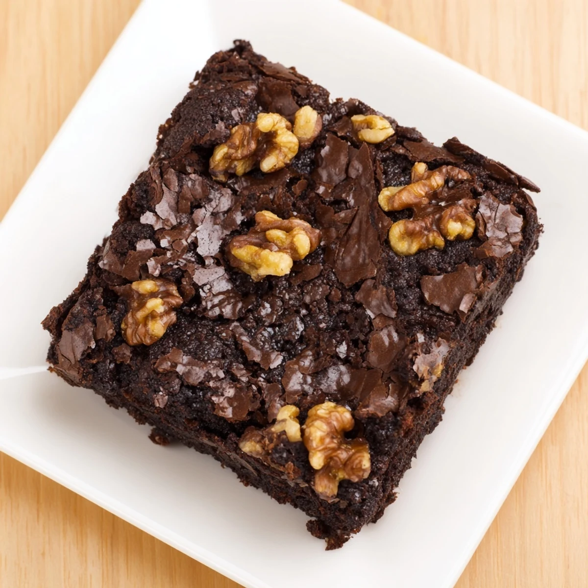 Warm, gooey Chocolate Fudge Brownies with walnuts, glistening with chocolate, ready to serve.