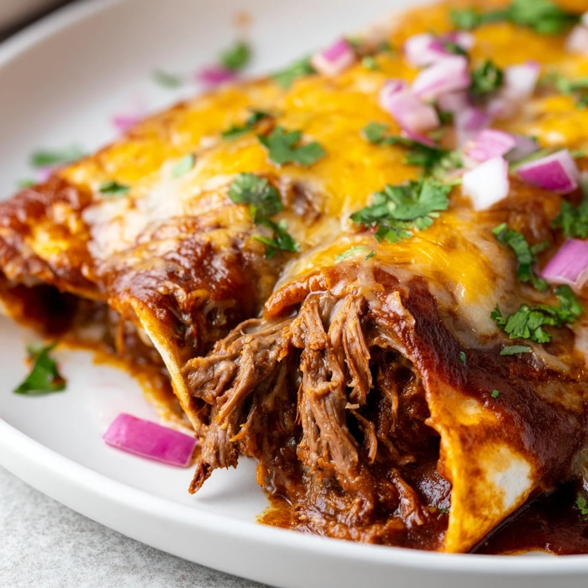 Golden bubbling Beef Enchiladas with Green Chili Sauce served hot from the oven, ready to enjoy.